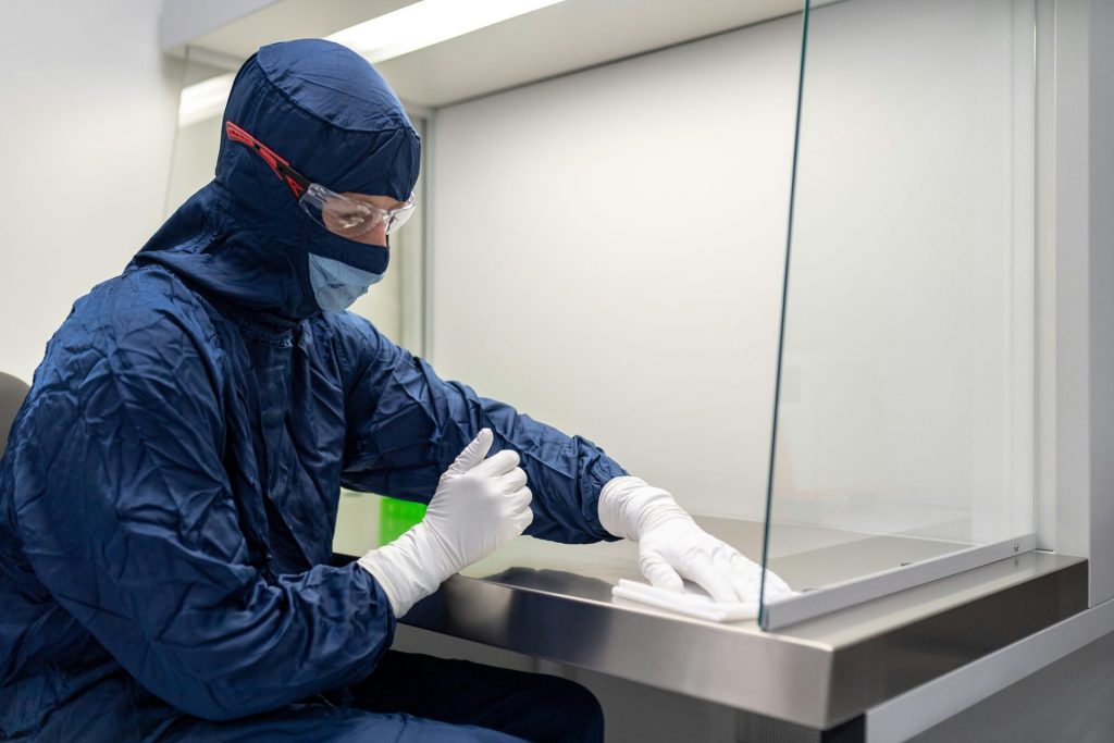 a person wearing a mask and gloves