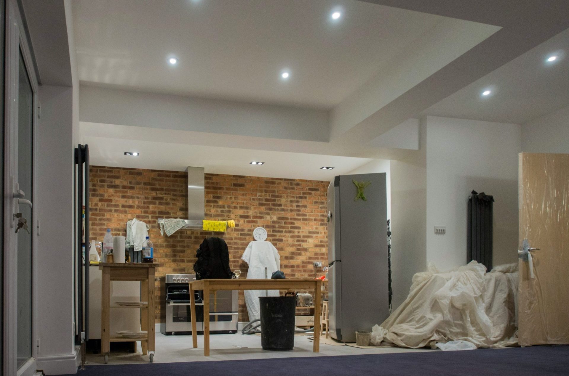 A kitchen and an open space in a house.